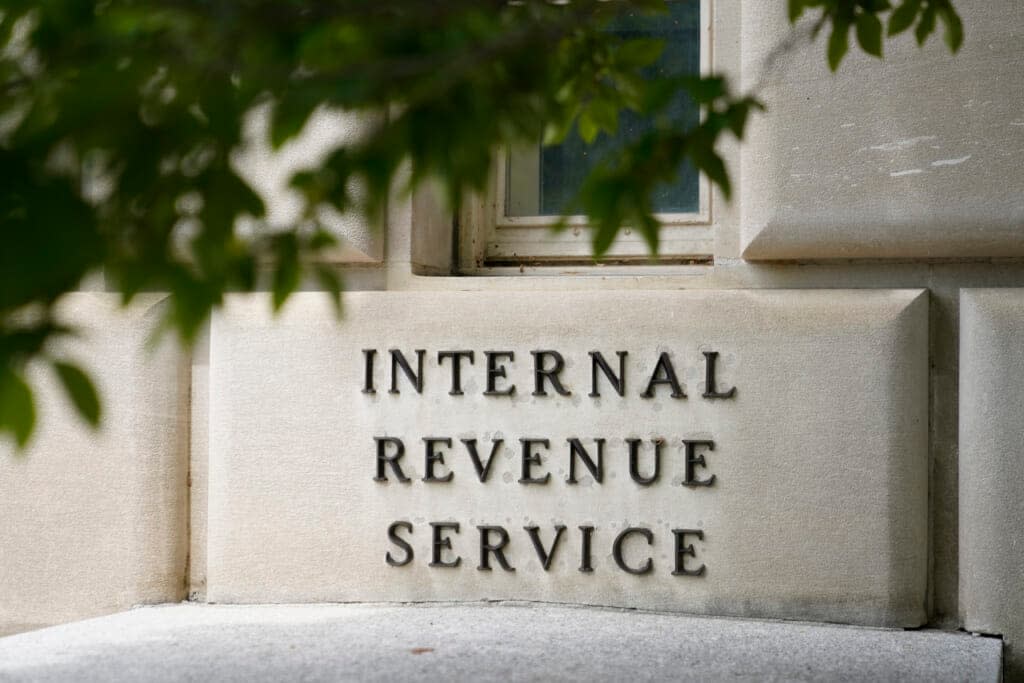 A sign outside the Internal Revenue Service building in Washington, on May 4, 2021. The Internal Revenue Service says it is conducting a comprehensive review of safety at its facilities. The action comes in response to an increasing number of threats born of conspiracy theories that agents were going to aggressively target middle-income taxpayers. (AP Photo/Patrick Semansky)