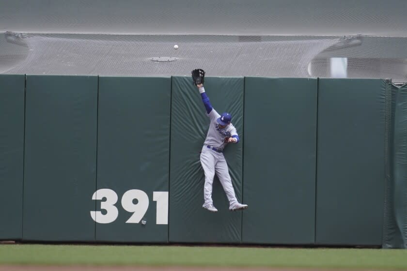 Los Angeles Dodgers center fielder Cody Bellinger cannot catch a home run hit by San Francisco Giants' Austin Slater during the first inning of a baseball game in San Francisco, Sunday, June 12, 2022. (AP Photo/Jeff Chiu)