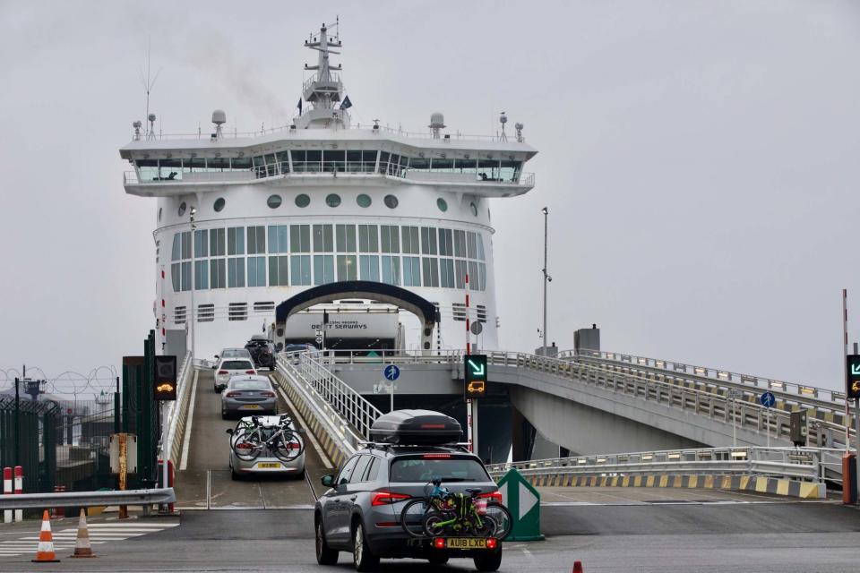 Cars are loaded onto a cross-channel ferry at the Port of Dunkerque, France hours before new restrictions come into force (AP)