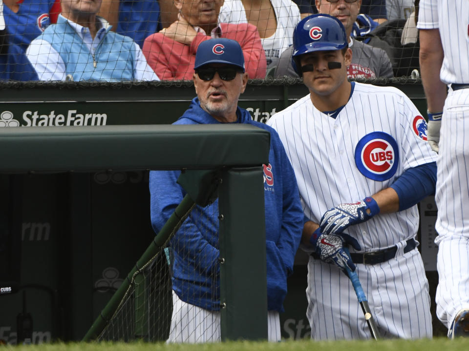 Chicago Cubs manager Joe Maddon, left, has an interesting offseason reading choice. (AP)