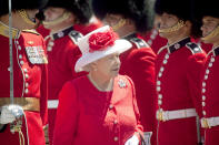 <p>Queen Elizabeth II is pictured here inspecting the Guard of Honour during Canada Day celebrations on Parliament Hill in Ottawa during her 2010 visit. (Photo by Geoff Robins/AFP via Getty Images)</p> 