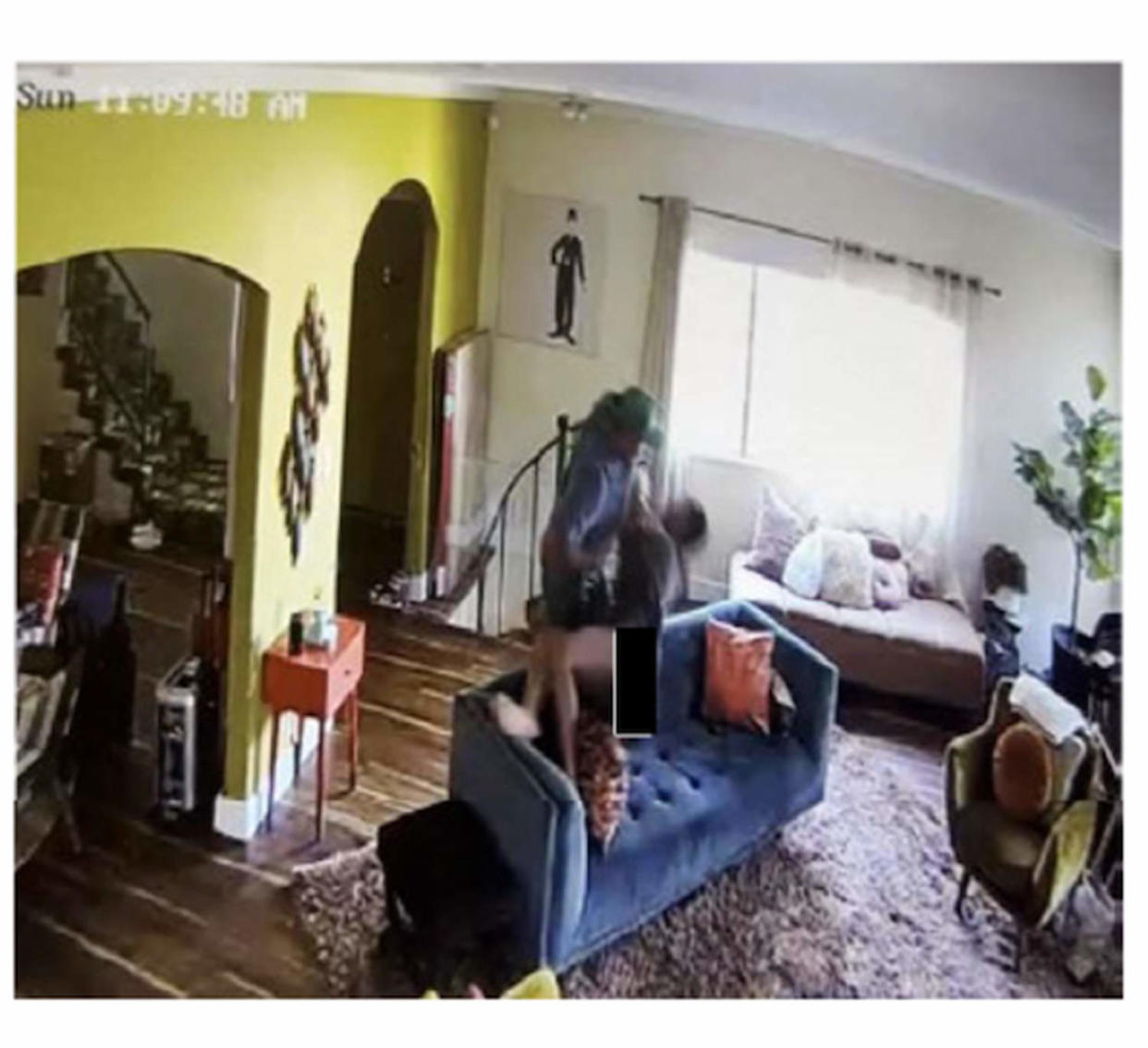A screenshot of home security footage showing Darius Jackson allegedly grabbing at Keke Palmer's neck and face and stealing her phone out of her hands at her home on Nov. 5, 2023. (Superior Court of California County of Los Angeles)