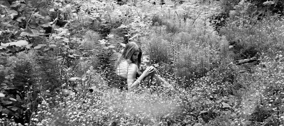 a person sitting in a field