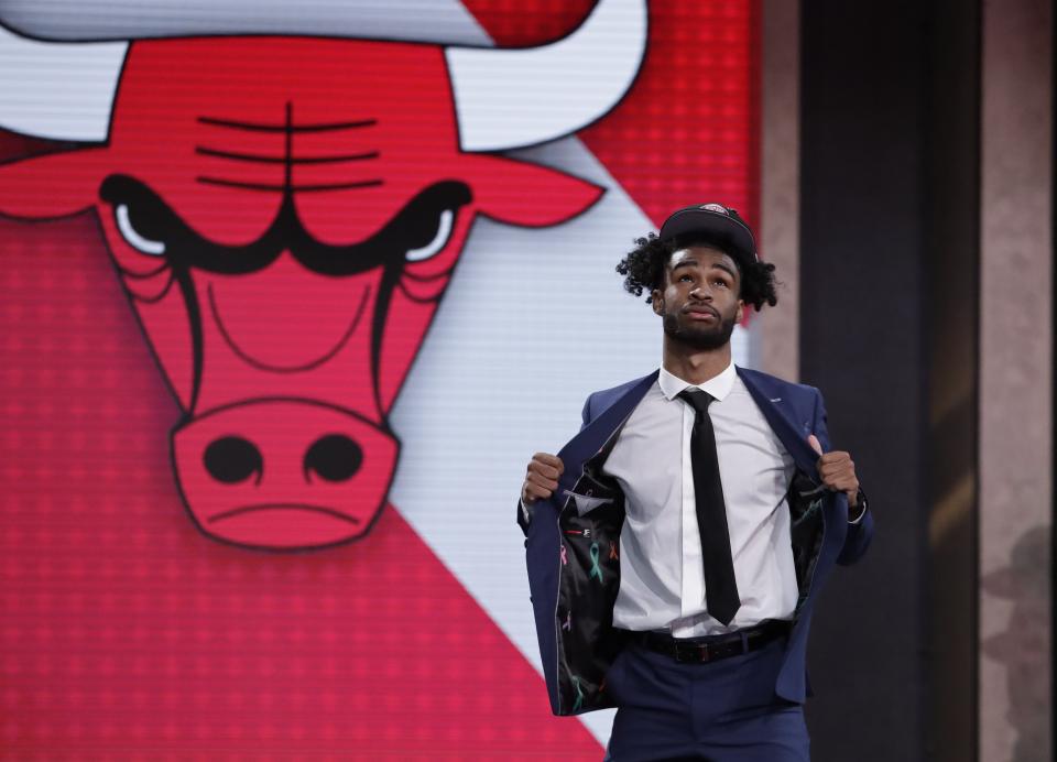 North Carolina's Coby White walks onstage after the Chicago Bulls selected him as the seventh overall in the NBA basketball draft Thursday, June 20, 2019, in New York. (AP Photo/Julio Cortez)