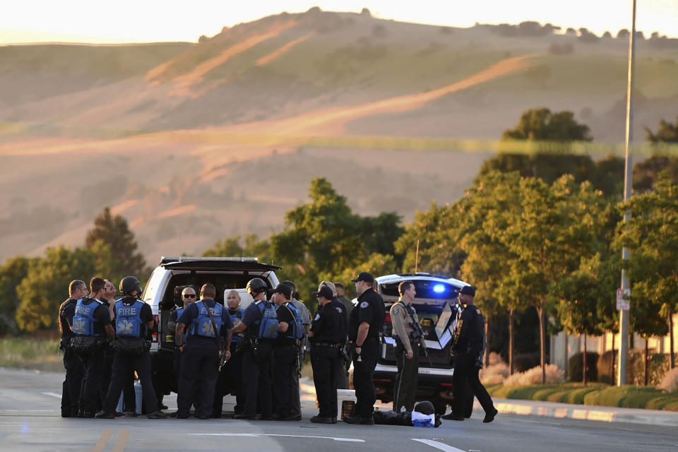 Police investigate at the scene of a shooting at the Morgan Hill Ford Store in Morgan Hill, Calif., Tuesday, June 25, 2019. Police say at least three people were shot in what may be a workplace confrontation. (AP Photo/Nic Coury)