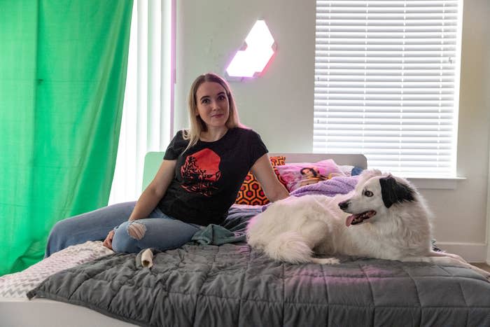 Twitch streamer Emilycc with her dog, Snowy, at her apartment in Austin on Nov. 23, 2022.