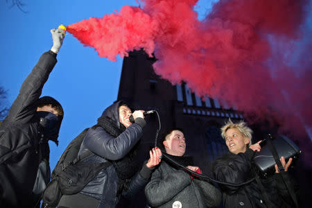 People gather to protest against plans to further restrict abortion laws, in Poznan, Poland March 23, 2018. Agencja Gazeta/Lukasz Cynalewski via REUTERS