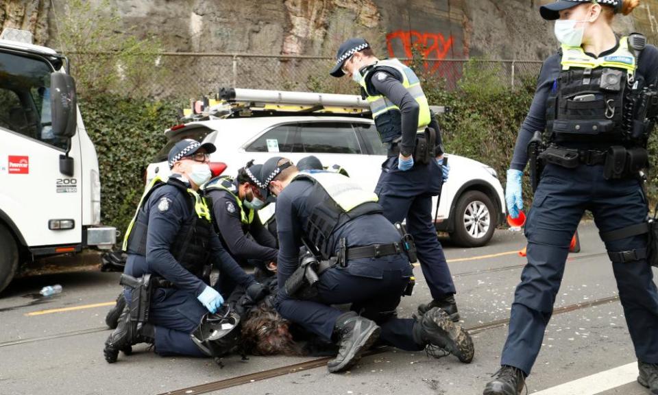 A man is arrested by police on Victoria Street, Richmond.