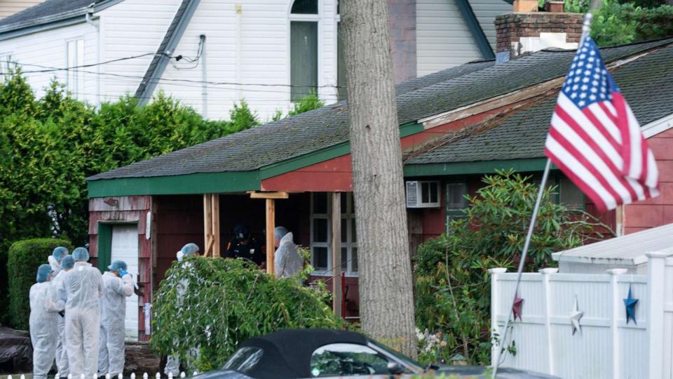 PHOTO: Crime laboratory officers arrive to the house where a suspect has been taken into custody on New York's Long Island in connection with a long-unsolved string of killings, July 14, 2023, in Massapequa, New York. (Eduardo Munoz Alvarez/AP)