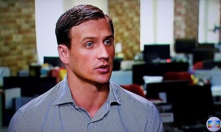 In this still image from video Olympic gold medallist swimmer Ryan Lochte of the U.S. gives an interview to Globo TV at their studios in New York City, August 20, 2016. Courtesy Globo TV via REUTERS