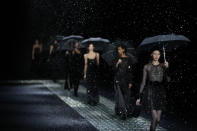 Models wear creations part of the Emporio Armani women's Fall-Winter 2024-25 collection presented in Milan, northern Italy, Thursday, Feb. 22, 2024. (AP Photo/Luca Bruno)