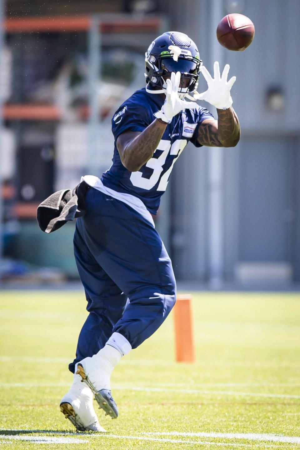 Seattle Seahawks running back Chris Carson catches a pass during the NFL football team's training camp Sunday Aug, 16, 2020, in Renton, Wash. (Bettina Hansen/The Seattle Times via AP, Pool)