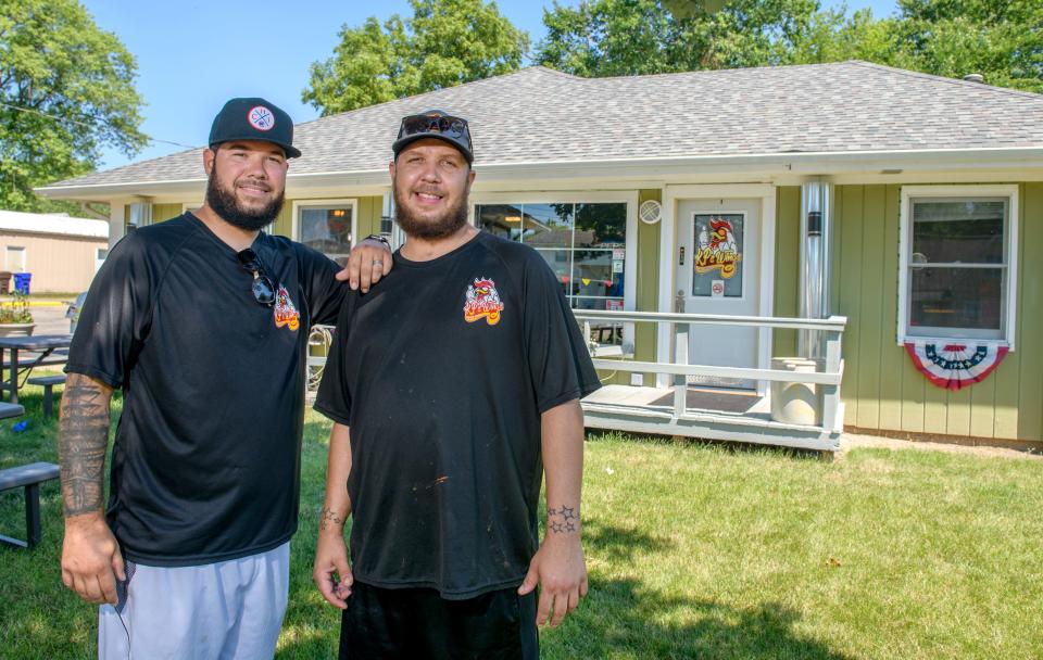 Brothers Kelly Petersen Jr., left, and Kyle Petersen run the new KP's Wings and Fries, 12521 W. Farmington Road in Hanna City with help from co-owner and their father Kelly Petersen.