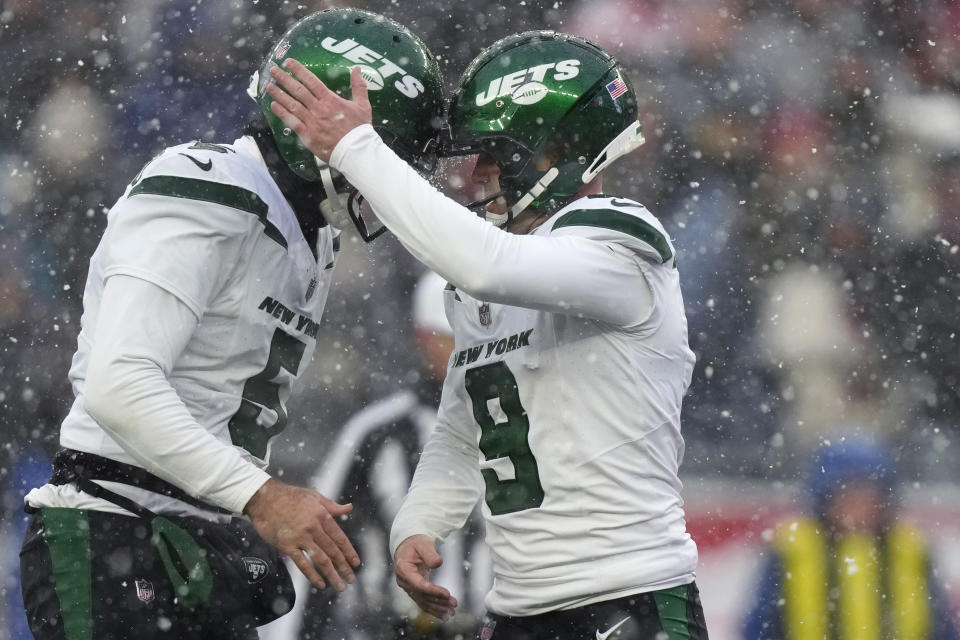 New York Jets place kicker Greg Zuerlein (9) is congratulated by Thomas Morstead after making a field goal during the first half of an NFL football game against the New England Patriots, Sunday, Jan. 7, 2024, in Foxborough, Mass. (AP Photo/Steven Senne)