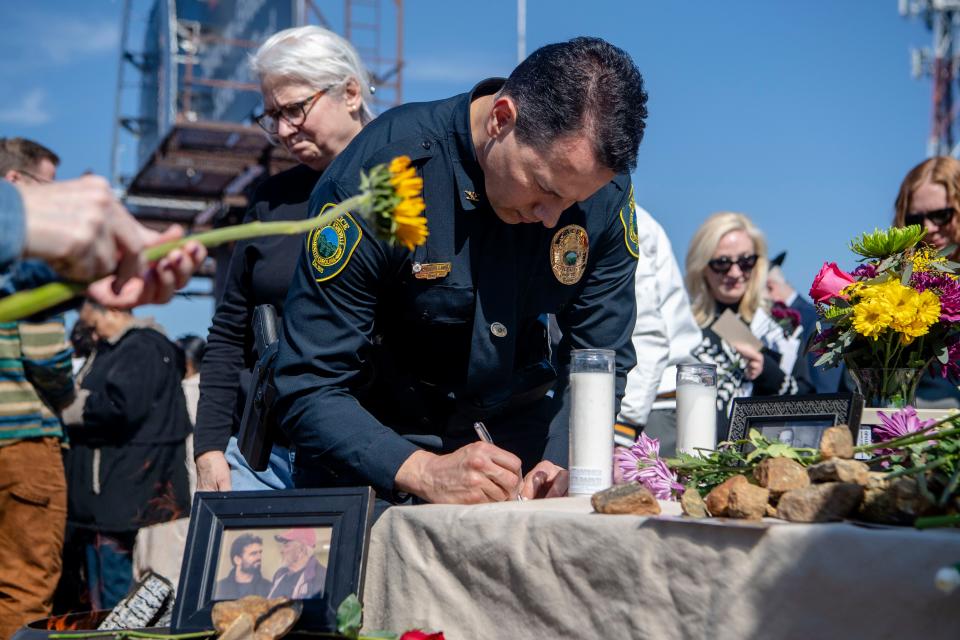 Asheville Police Chief Mike Lamb contributes to an offering table at the groundbreaking ceremony of the Haywood Street Community Development, February 21, 2024.