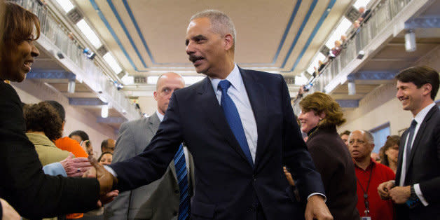 WASHINGTON, DC - APRIL 24:  U.S. Attorney General Eric Holder shakes hands with Justice Department employees after delivering his parting remarks at the Robert F. Kennedy building April 24, 2015 in Washington, DC. The first African American attorney general in U.S. history, Holder is leaving his post as the country's highest ranking law enforcement official after six years on the job and will be succeeded by Loretta Lynch.  (Photo by Chip Somodevilla/Getty Images) (Photo: )