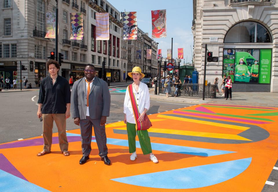 Artists (left to right) Michael Armitage, Vanessa Jackson and Issac Julian at Piccadilly Circus (PA)