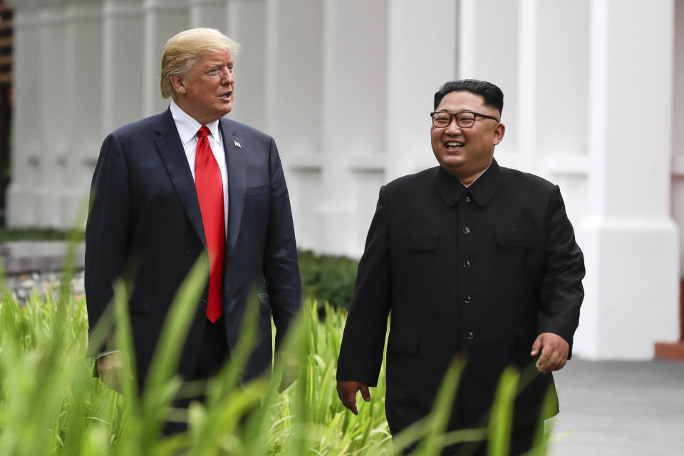 U.S. President Donald Trump and North Korea leader Kim Jong Un walk from their lunch at the Capella resort on Sentosa Island. (AP Photo/Evan Vucci)