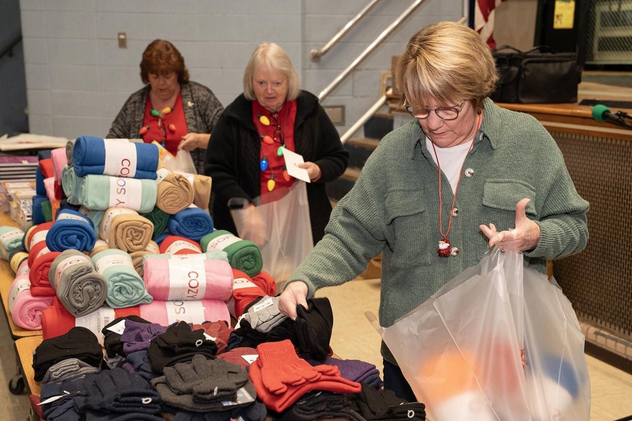 American Legion Auxiliary volunteers pick out gifts for patients at the Battle Creek VA Medical Center. The 2023 Remember-A-Vet campaign continues through Jan. 1.