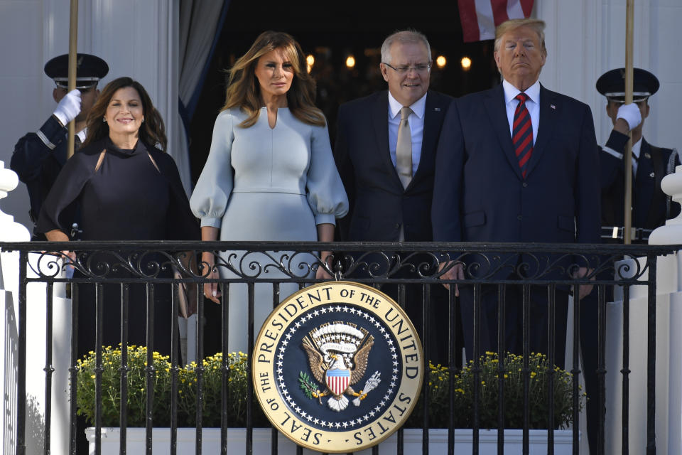 President Donald Trump, right, and first lady Melania Trump, second from left, pose for a photo with Australian Prime Minister Scott Morrison, second from right, and his wife Jenny Morrison, left, during a state arrival ceremony on the South Lawn of the White House in Washington, Friday, Sept. 20, 2019. (AP Photo/Susan Walsh)