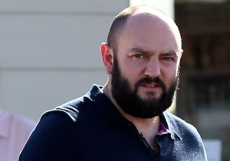 FILE PHOTO: Simon Dowson is pictured as he walks to his car in Consett, Britain, September 30, 2016. REUTERS/Scott Heppell/File Photo