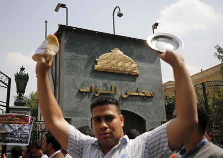 The sign of parliament headquarters is seen during a protest in front of the parliament headquarters in Cairo, Egypt March 27, 2016. REUTERS/Amr Abdallah Dalsh/File Photo