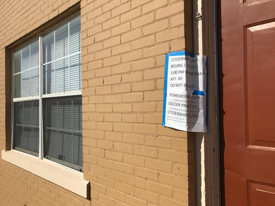 A sign advertising classes for refugees at a community center inside the Astoria Park Apartments in Amarillo, Texas. (Photo: Holly Bailey/Yahoo News)