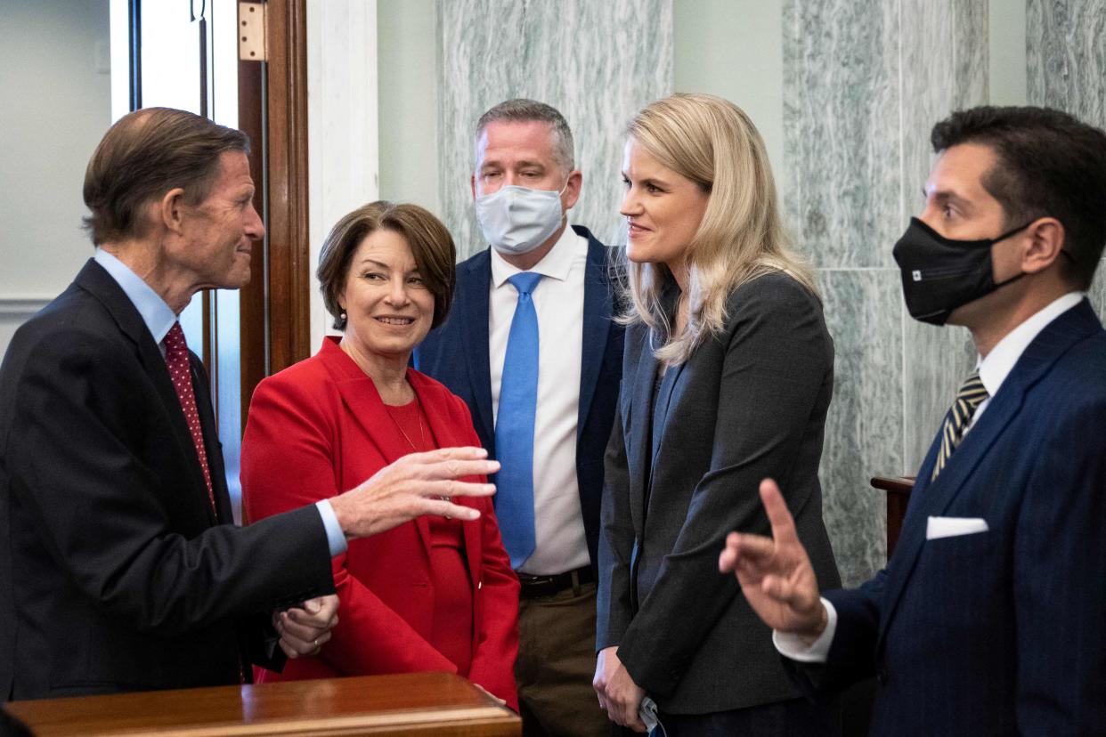 Former Facebook employee and whistleblower Frances Haugen (2nd R) is welcomed by US Senators Richard Blumenthal (L) and Amy Klobuchar (2nd L) as she arrives to testify during a Senate Committee on Commerce, Science, and Transportation hearing on Capitol Hill, October 5, 2021, in Washington, DC. (Photo by Drew Angerer / POOL / AFP) (Photo by DREW ANGERER/POOL/AFP via Getty Images)