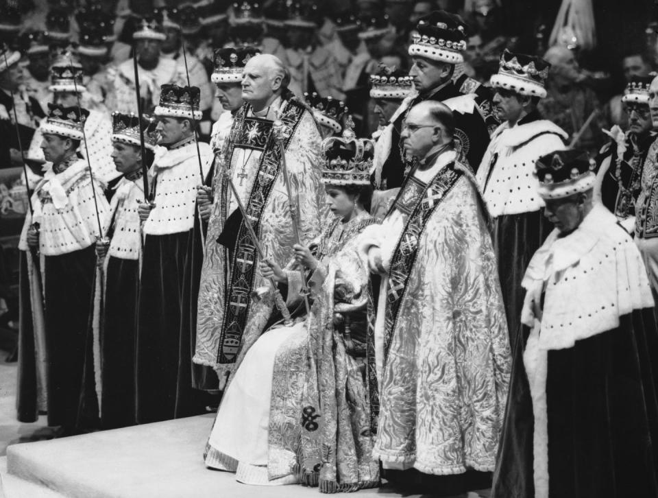 2nd june 1953 queen elizabeth ii seated upon the throne at her coronation in westminster abbey, london she is holding the royal sceptre ensign of kingly power and justice and the rod with the dove symbolising equity and mercy photo by topical press agencygetty images