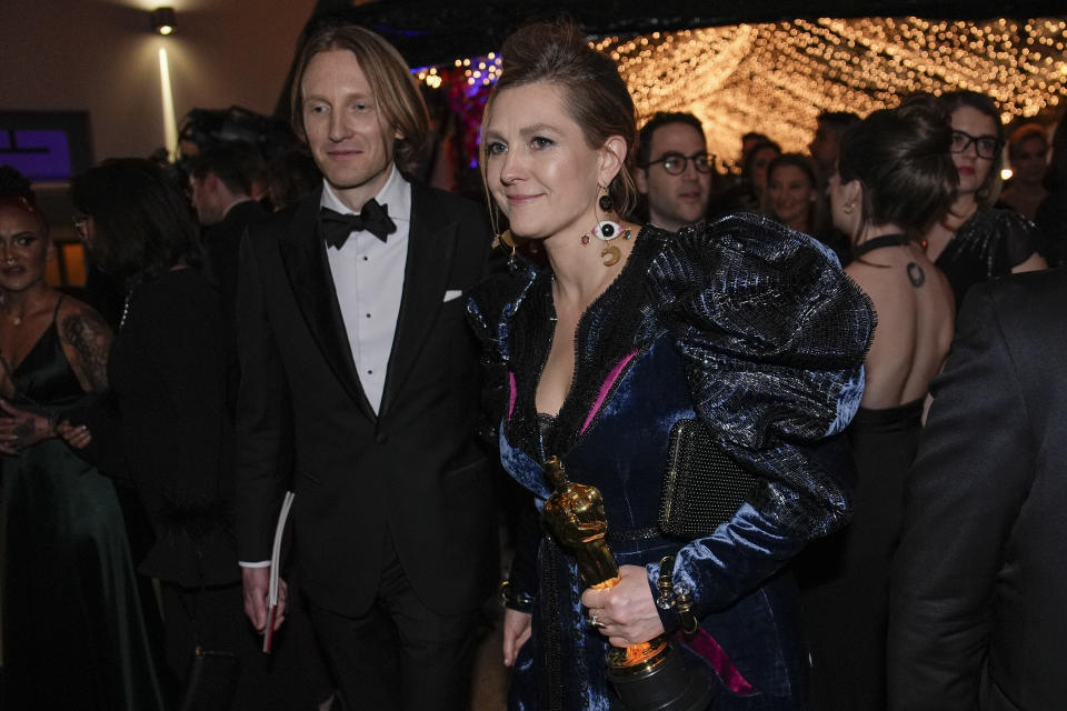 Holly Waddington, right, winner of the award for best costume design for "Poor Things," attends the Governors Ball after the Oscars on Sunday, March 10, 2024, at the Dolby Theatre in Los Angeles. (AP Photo/John Locher)