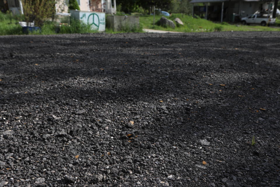 Dumped and spread RAP covers a road located within Neskonlith Indian Reserve number two on May 15. Photo by Aaron Hemens