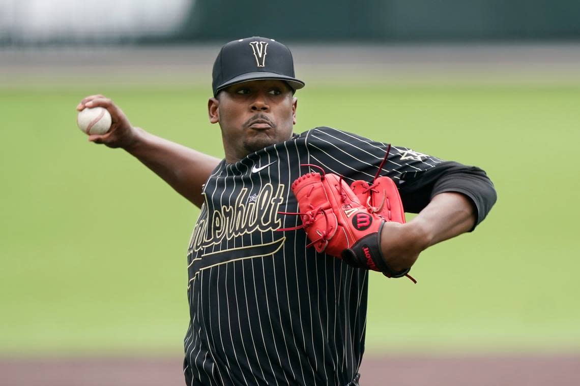 FILE -Vanderbilt pitcher Kumar Rocker throws against East Carolina during the first inning of an NCAA college baseball super regional game Friday, June 11, 2021, in Nashville, Tenn. Right-hander Kumar Rocker agreed Friday, May 13, 2022, to a contract with the independent Tri-City ValleyCats after failing to sign with the New York Mets last summer.(AP Photo/Mark Humphrey, File)