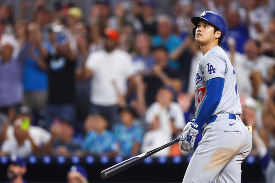 Ohtani watches as his 50th HR of the season sails over the fence. (Megan Briggs/Getty Images)