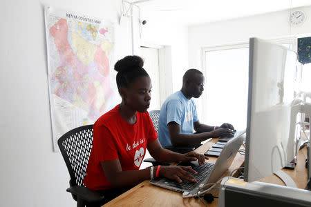 Dispatchers watch screens while on shift at the Rescue.co command centre in Nairobi, Kenya January 30, 2019. Picture taken January 30, 2019. REUTERS/Baz Ratner