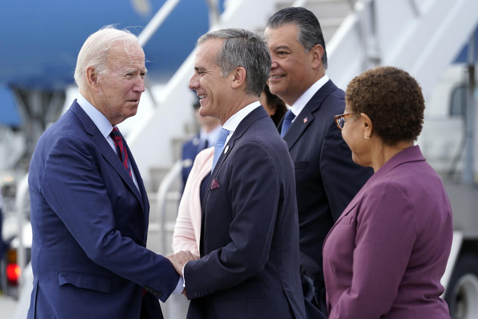 FILE - President Joe Biden greets, from front right, Rep. Karen Bass, D-Calif., Los Angeles Mayor Eric Garcetti, Sen. Alex Padilla, D-Calif., and his wife Angela Padilla, after arriving on Air Force One at Los Angeles International Airport, Wednesday, Oct. 12, 2022. (AP Photo/Carolyn Kaster, File)