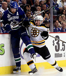 Marchand has been a thorn in the side of both Daniel (left) and Henrik Sedin