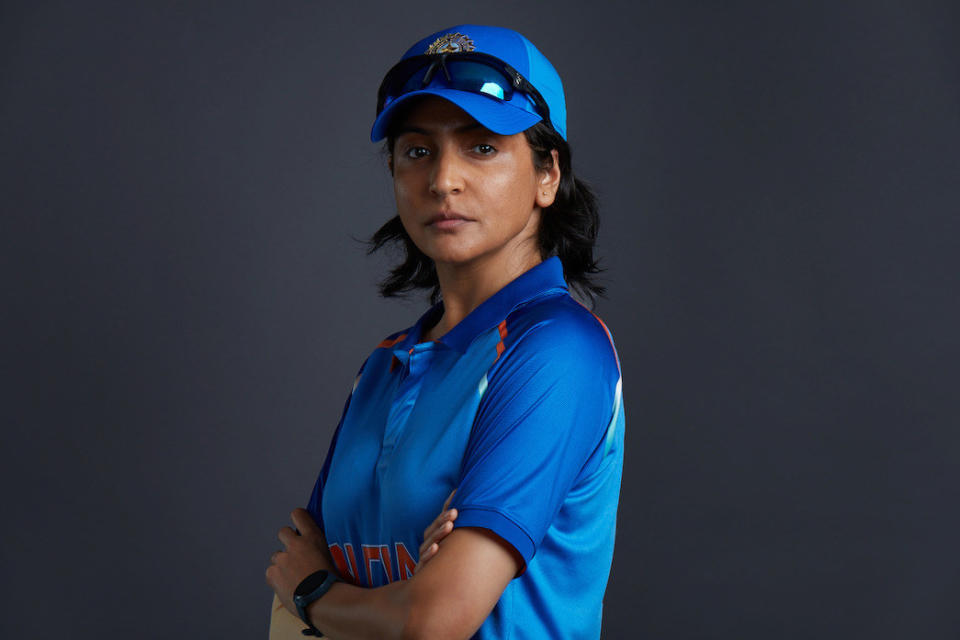 closeup of a woman wearing a uniform jersey and cap