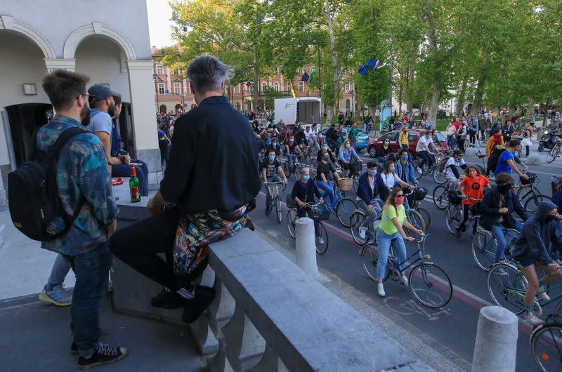 Protesters ride bicycles during an anti-government protest in Ljubljana