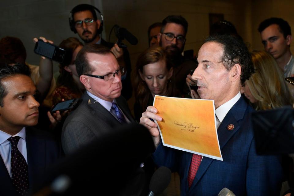 Rep. Jamie Raskin, D-Md., holds up documents as he talks with reporters on Capitol Hill in Washington, Wednesday, Oct. 2, 2019. (AP Photo/Susan Walsh)