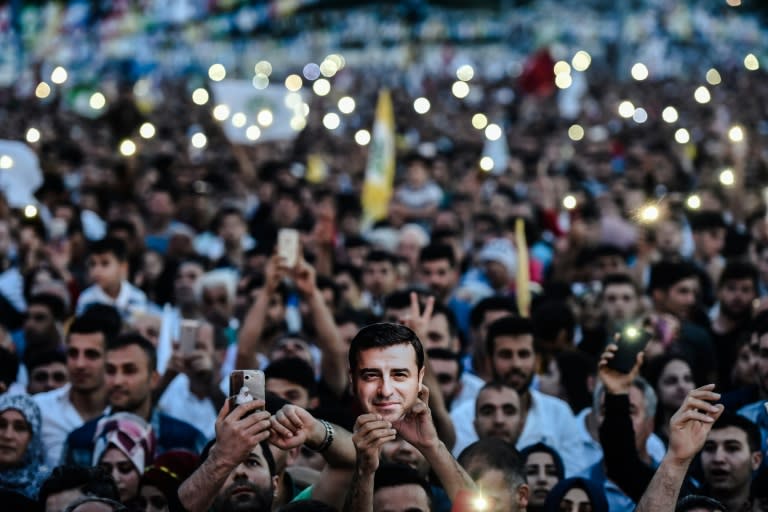 Supporters of imprisoned Selahattin Demirtas, presidential candidate of People's Democratic Party (HDP), hold up the lights of their phones during a rally in Istanbul