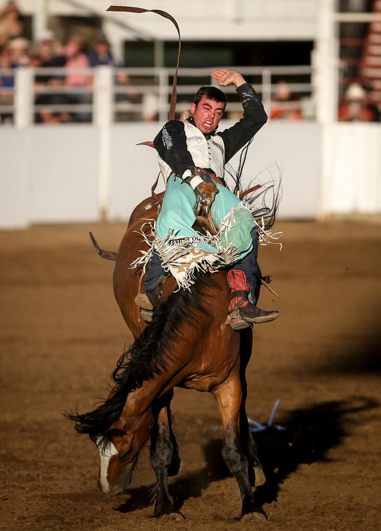 Bradlee Miller of Huntsville, Texas, competes in bareback riding at the St. Paul Rodeo on Friday, June 30, 2023, in St. Paul, Ore.