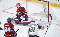 Vegas Golden Knights' Jonathan Marchessault celebrates a goal by Alex Pietrangelo on Montreal Canadiens goaltender Carey Price during the third period of Game 3 of an NHL hockey semifinal series, Friday, June 18, 2021, in Montreal. (Paul Chiasson/The Canadian Press via AP)