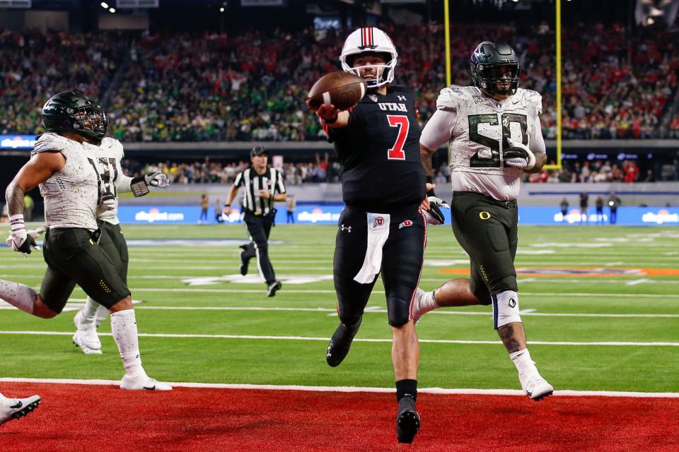 Utah quarterback Cameron Rising (7) runs for a two-point conversion during the third quarter to give the Utes a 30-3 lead over Oregon in Friday's Pac-12 championship game in Las Vegas.