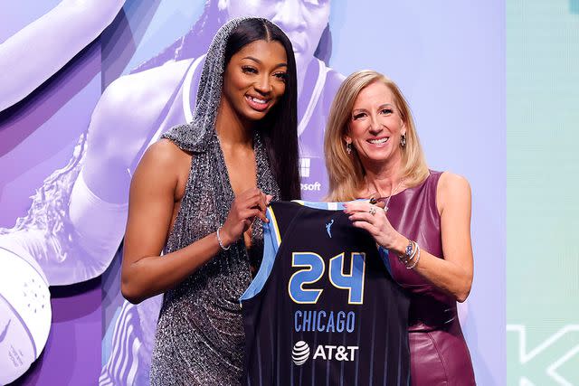 <p>Sarah Stier/Getty</p> Angel Reese poses with WNBA Commissioner Cathy Engelbert at 2024 Draft.