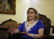 Leila Saleh, wife of Lebanese citizen Mohammed Saleh who was detained in Greece last week, speaks during an interview at their home in a suburb of the southern port city of Sidon, Lebanon, Tuesday, Sept. 24, 2019. Saleh was detained in Greece on suspicion of involvement in a 1985 TWA hijacking and set free after it turned out to be a case of mistaken identity is in good health and expected to fly back to Lebanon, the man and his wife said Tuesday. (AP Photo/Bilal Hussein)