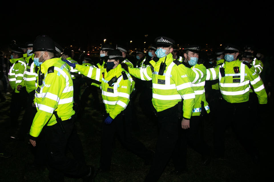 Hundreds of people gathered  at a peaceful vigil for Sarah Everard on Clapham Common in South London on the 13th of March 2021, London, United Kingdom. Sarah Everard went missing on 3 March after setting off at 9pm from a friends house to make her two and a half mile journey home. The police retreats out of the common in an orderly fashion. The vigil was also a call to end violence against girls and women perpetrated by men. The vigil was not sanctioned by police because of Covid restrictions and the police decided to arrest a number of people in an attempt to end the peaceful and highly emotional vigil. The event took place at the band stand on the common and speeches were held from the stand till police confiscated the sound equipment.(photo by Kristian Buus/In Pictures via Getty Images)