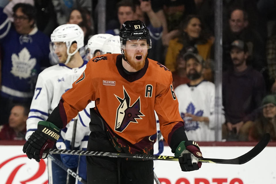 Arizona Coyotes left wing Lawson Crouse shouts as the Toronto Maple Leafs celebrate a goal by Maple Leafs' Calle Jarnkrok during the first period of an NHL hockey game in Tempe, Ariz., Thursday, Dec. 29, 2022. (AP Photo/Ross D. Franklin)