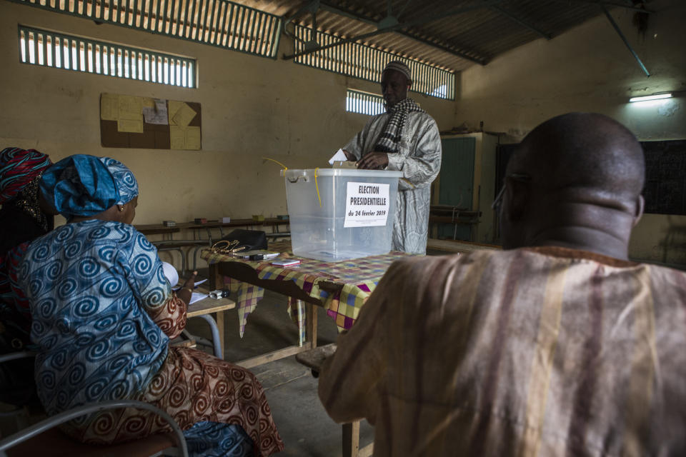 A Senegalese man casts his ballot at a polling station in Dakar, Senegal Sunday Feb. 24, 2019. Voters are choosing whether to give President Macky Sall a second term in office as he faces four challengers.(AP Photo/Jane Hahn)