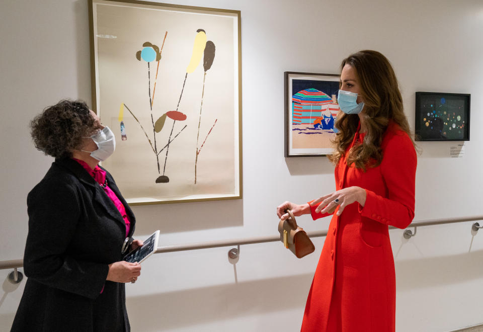 <p>The Duchess of Cambridge with Catsou Roberts, Director of Vital Arts for Barts Health NHS Trust, during a visit to the Royal London Hospital in Whitechapel, east London, to mark the publication of the Hold Still book. Picture date: Friday May 7, 2021.</p>
