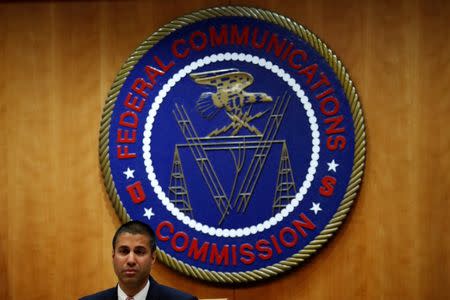 FILE PHOTO - Chairman Ajit Pai speaks ahead of the vote on the repeal of so called net neutrality rules at the Federal Communications Commission in Washington, U.S., December 14, 2017. REUTERS/Aaron P. Bernstein